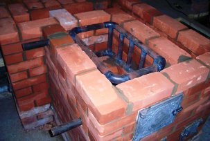 Heating a private house with a stove with a water boiler