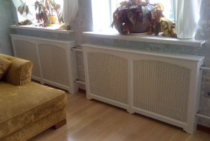 Druhy dekorativních clon pro radiátory podle konfigurace a materiálu výroby