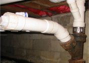 How to dock cast iron sewer with plastic