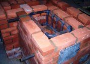 Do-it-yourself brick stove with a water heating boiler