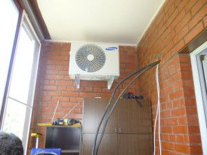 outdoor unit on a glazed loggia